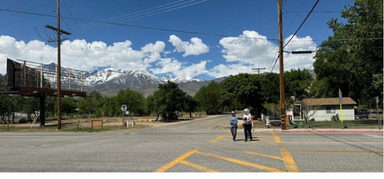 Two women in crosswalk in Big Pine California.
